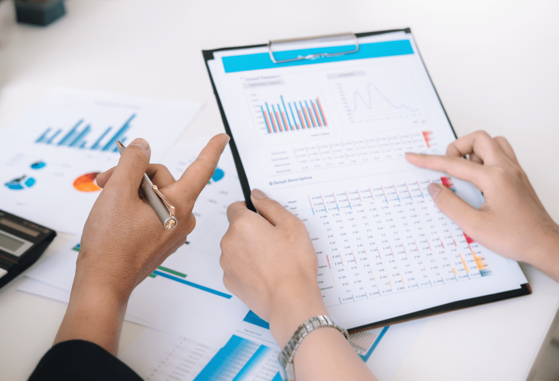 Two staff members looking at data and figures to show how industry consultants can help with your non-revenue water management